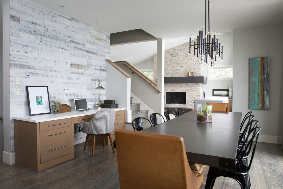 Inspiration for a large contemporary medium tone wood floor and brown floor great room remodel in Calgary with white walls and no fireplace