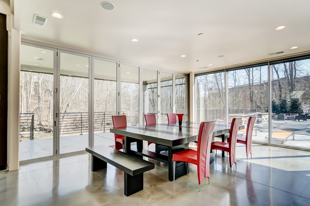 Design ideas for a contemporary dining room in Cincinnati with concrete flooring, no fireplace and grey floors.