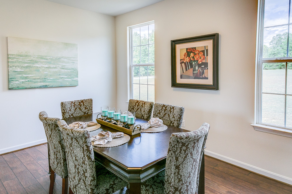 Photo of a medium sized classic enclosed dining room in DC Metro with white walls.