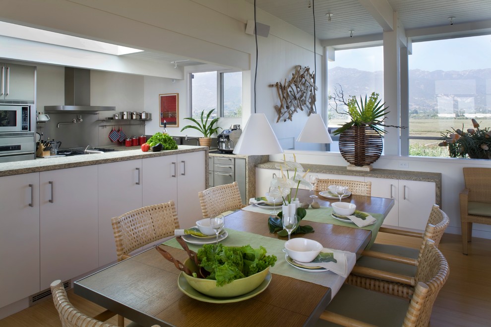 This is an example of a contemporary dining room in Santa Barbara with white walls.
