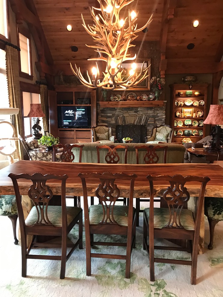 Mid-sized mountain style dark wood floor and brown floor enclosed dining room photo in Other with beige walls and no fireplace