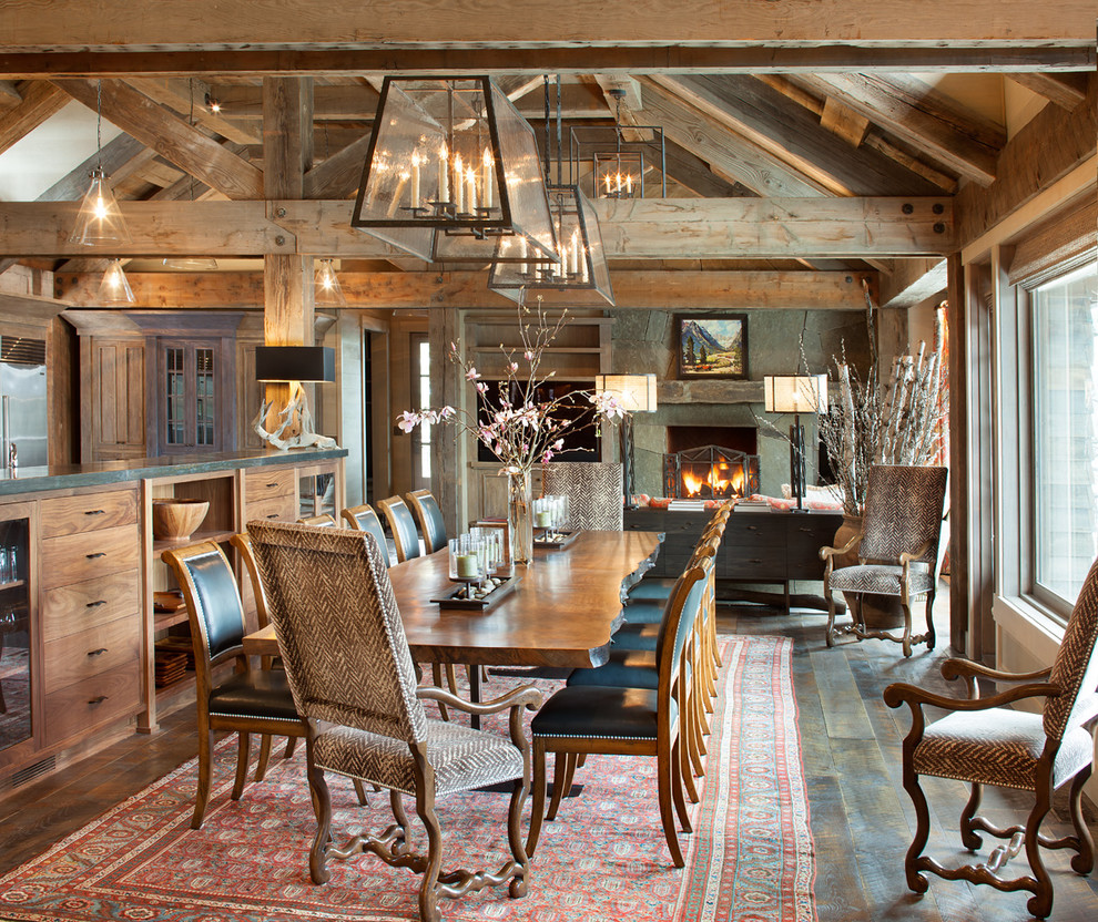 This is an example of a rustic open plan dining room in Other with feature lighting.