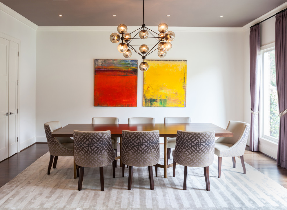 Example of a trendy dining room design in Houston with white walls