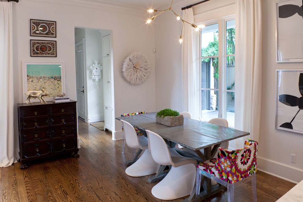 Inspiration for a transitional dark wood floor dining room remodel in Houston with white walls