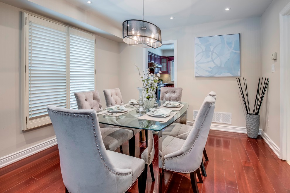 Photo of a medium sized contemporary open plan dining room in Toronto with grey walls, dark hardwood flooring and brown floors.