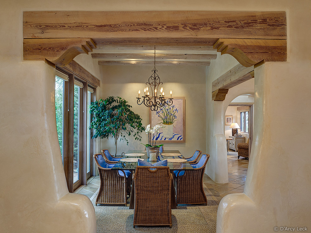 Mid-sized southwest terra-cotta tile enclosed dining room photo in Albuquerque with beige walls