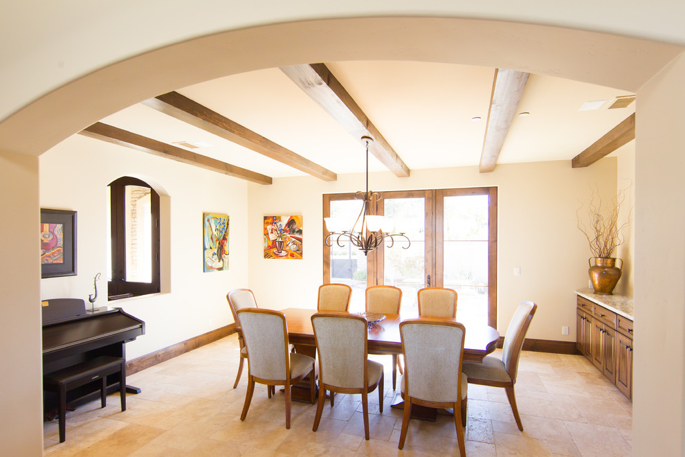 This is an example of a medium sized mediterranean enclosed dining room in San Luis Obispo with beige walls, travertine flooring and no fireplace.