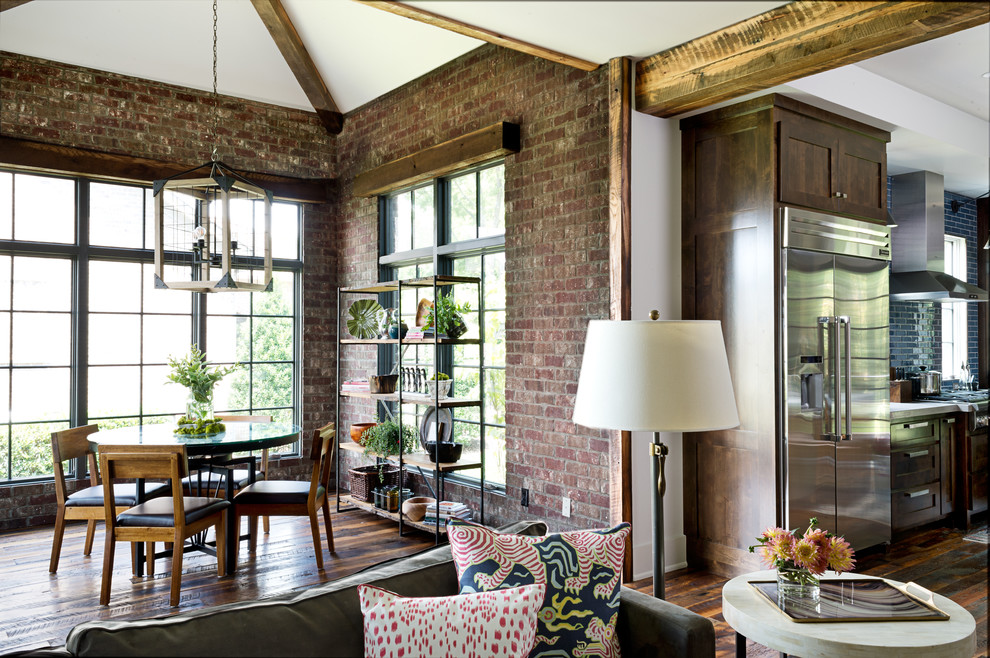 Example of a large transitional medium tone wood floor and brown floor great room design in Other with red walls