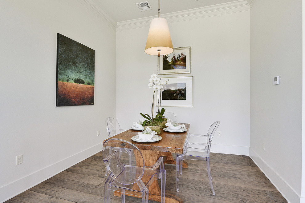 Inspiration for a mid-sized contemporary medium tone wood floor kitchen/dining room combo remodel in New Orleans with white walls