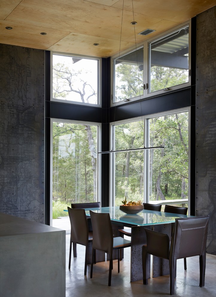 This is an example of a medium sized dining room in Houston.