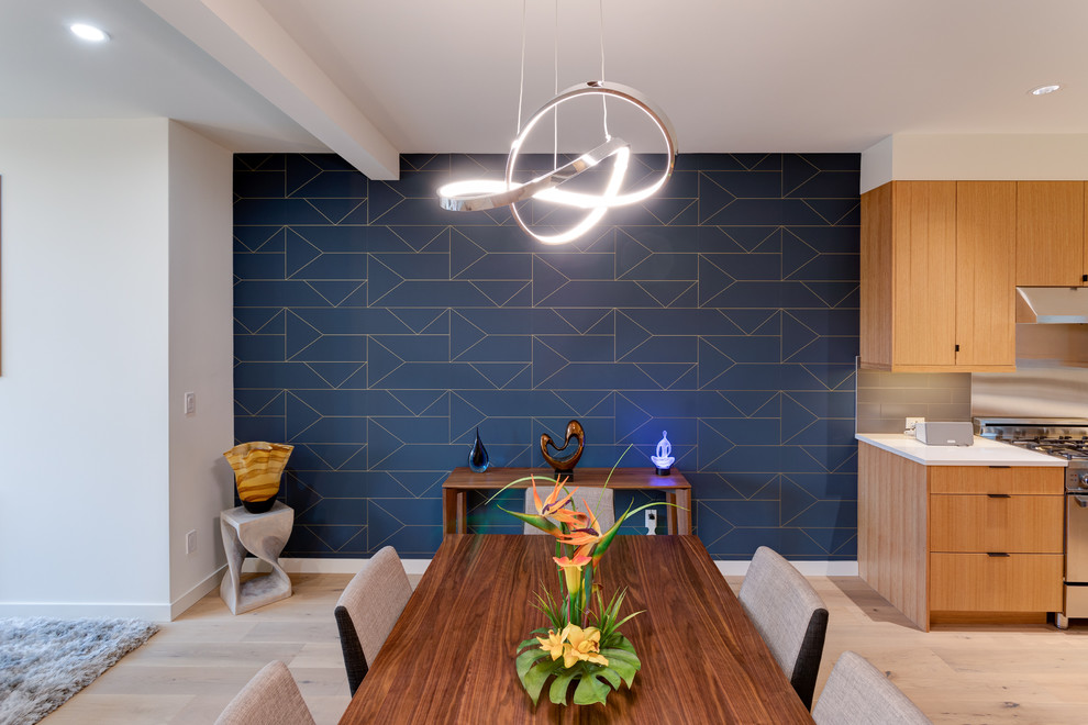 Mid-sized minimalist medium tone wood floor kitchen/dining room combo photo in Seattle with blue walls