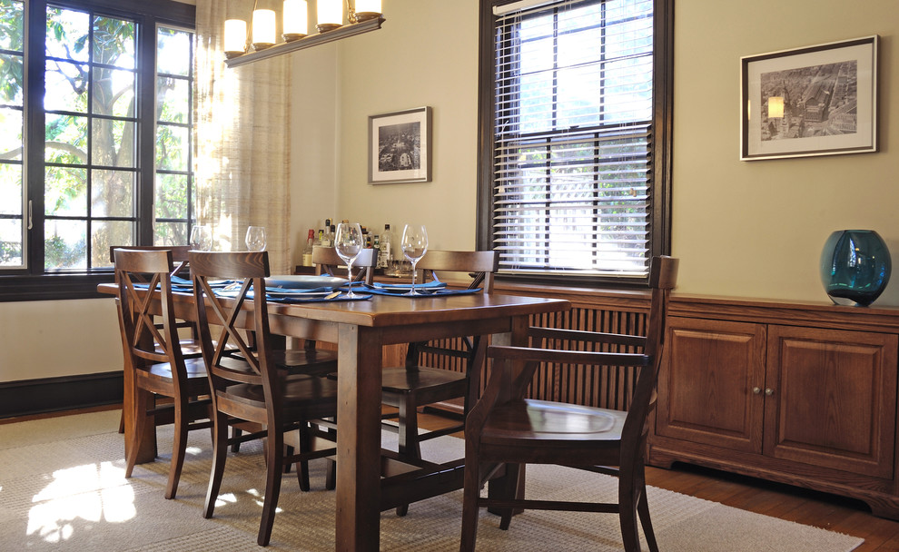 Medium sized classic dining room in DC Metro with beige walls, medium hardwood flooring and brown floors.