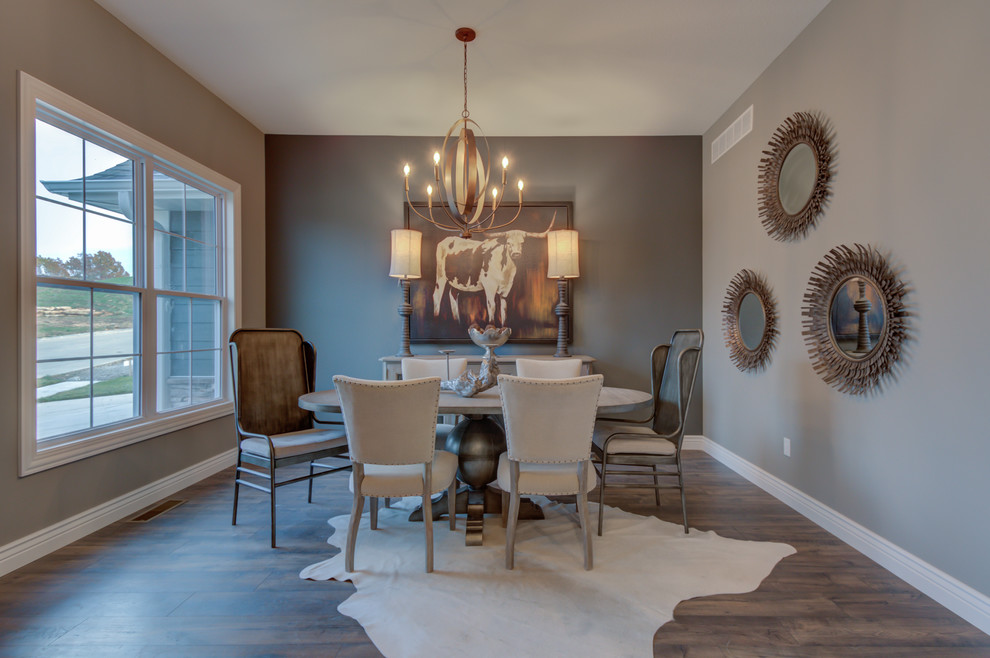 Inspiration for a traditional enclosed dining room in Other with grey walls, dark hardwood flooring and brown floors.