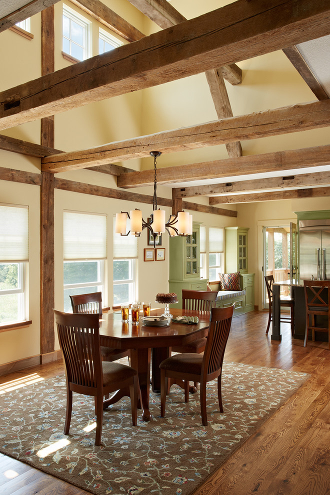 Example of a country dark wood floor dining room design in Minneapolis with beige walls