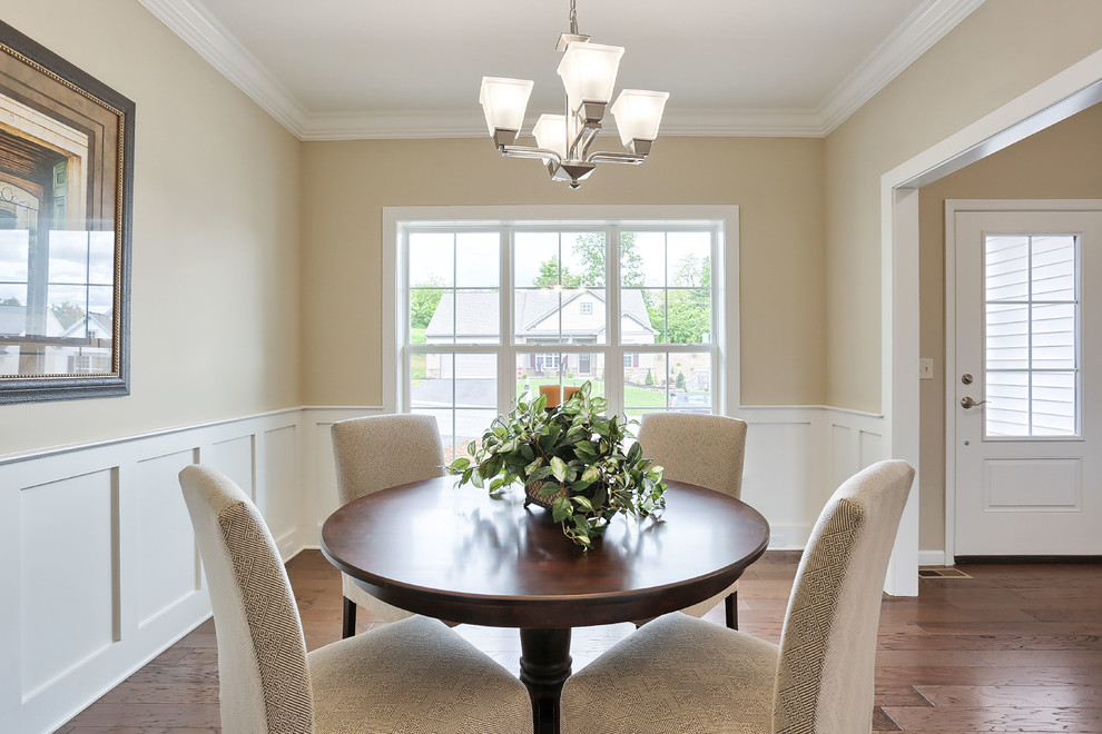 Photo of a large classic kitchen/dining room in Other with beige walls and medium hardwood flooring.