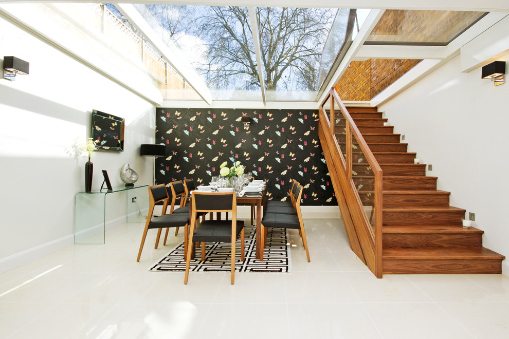Design ideas for a contemporary dining room in London with multi-coloured walls.