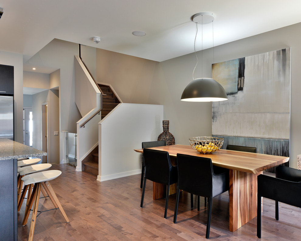 Trendy medium tone wood floor kitchen/dining room combo photo in Ottawa with gray walls