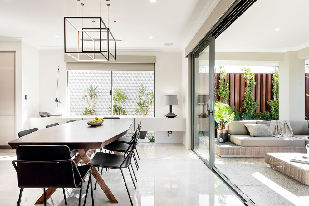 Contemporary dining room in Perth with beige walls and beige floors.