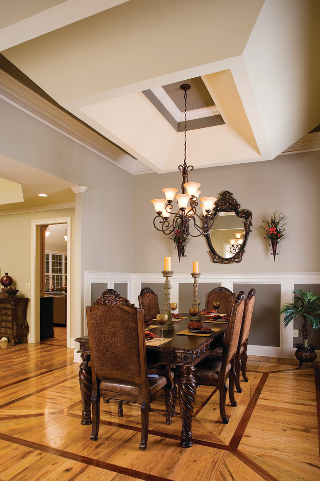 Inspiration for a timeless dining room remodel in Charlotte with gray walls