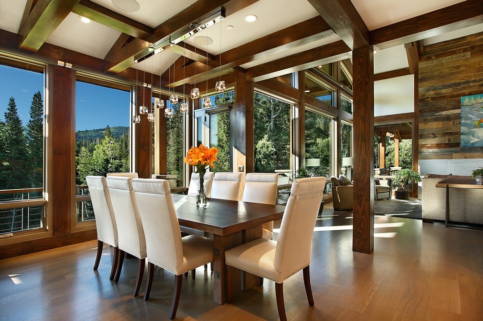Large mountain style medium tone wood floor great room photo in Salt Lake City with white walls