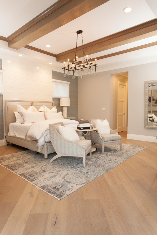Example of a medium tone wood floor and beige floor bedroom design in Miami