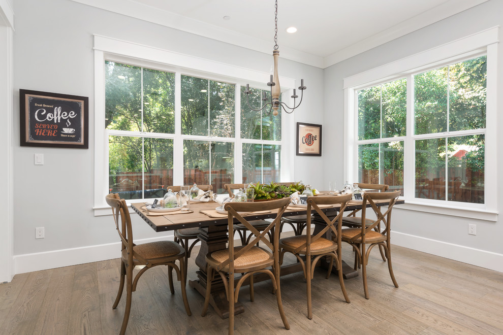 Country enclosed dining room in San Francisco with grey walls, dark hardwood flooring and brown floors.