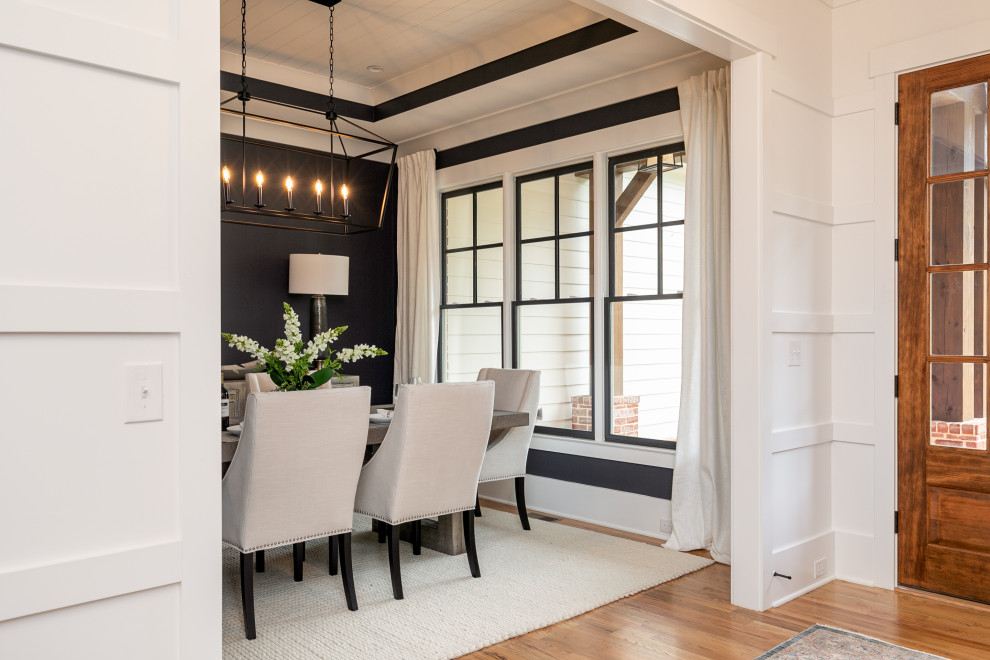 Mid-sized arts and crafts medium tone wood floor, brown floor and shiplap ceiling enclosed dining room photo in Atlanta with black walls and no fireplace