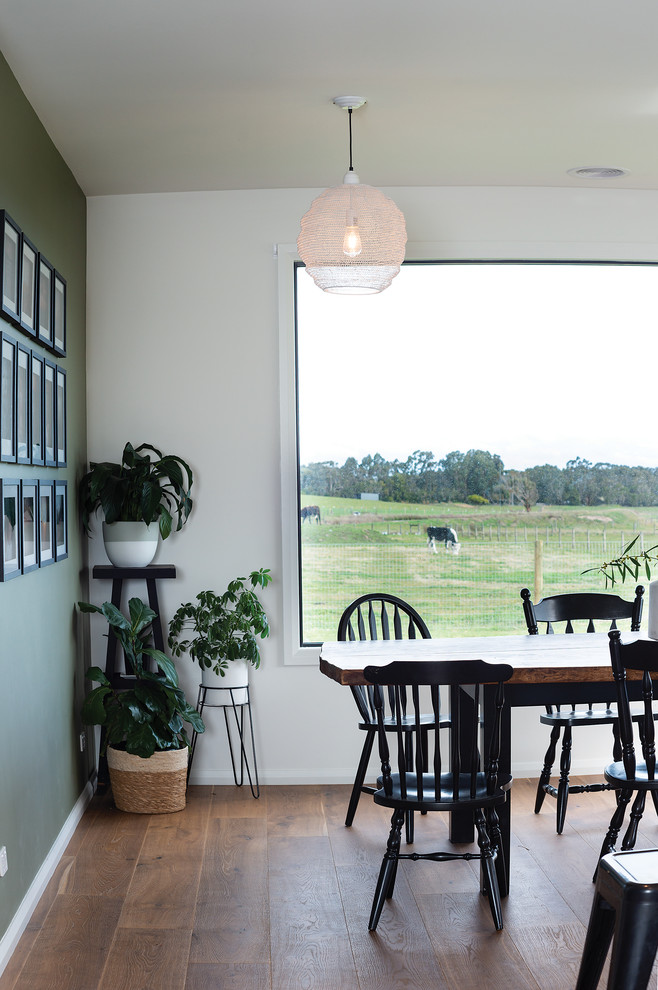 Large rural kitchen/dining room in Melbourne with green walls, dark hardwood flooring and brown floors.