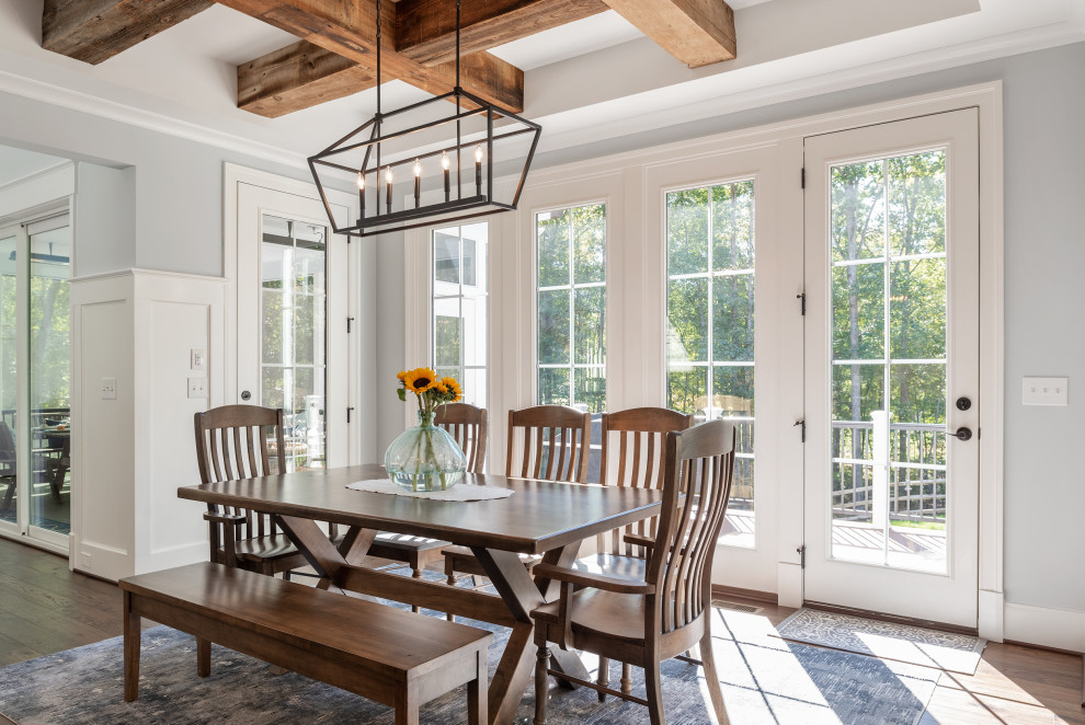 Inspiration for a large transitional medium tone wood floor, brown floor, coffered ceiling, exposed beam and wall paneling kitchen/dining room combo remodel in DC Metro with blue walls and no fireplace