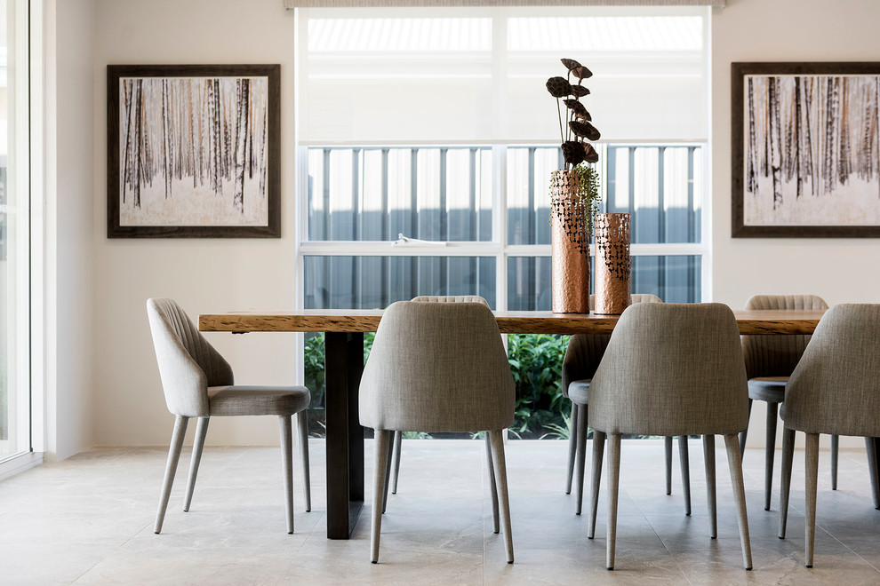 Idee per una sala da pranzo aperta verso il soggiorno contemporanea di medie dimensioni con pareti bianche e pavimento con piastrelle in ceramica
