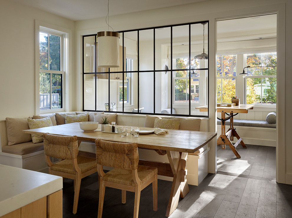 Example of a farmhouse dark wood floor and brown floor dining room design in San Francisco with white walls