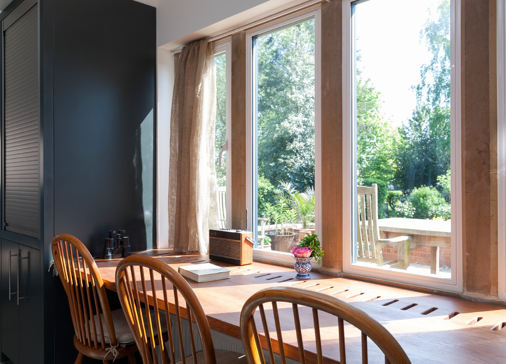 Medium sized contemporary enclosed dining room in Wiltshire.