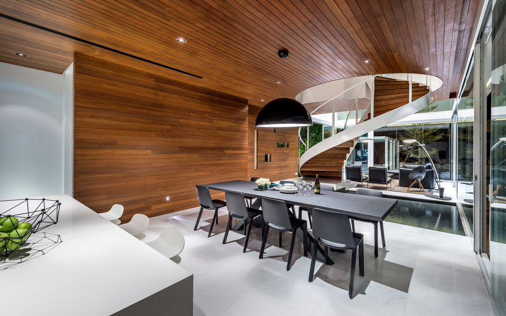 Cette image montre une salle à manger ouverte sur la cuisine design avec aucune cheminée.