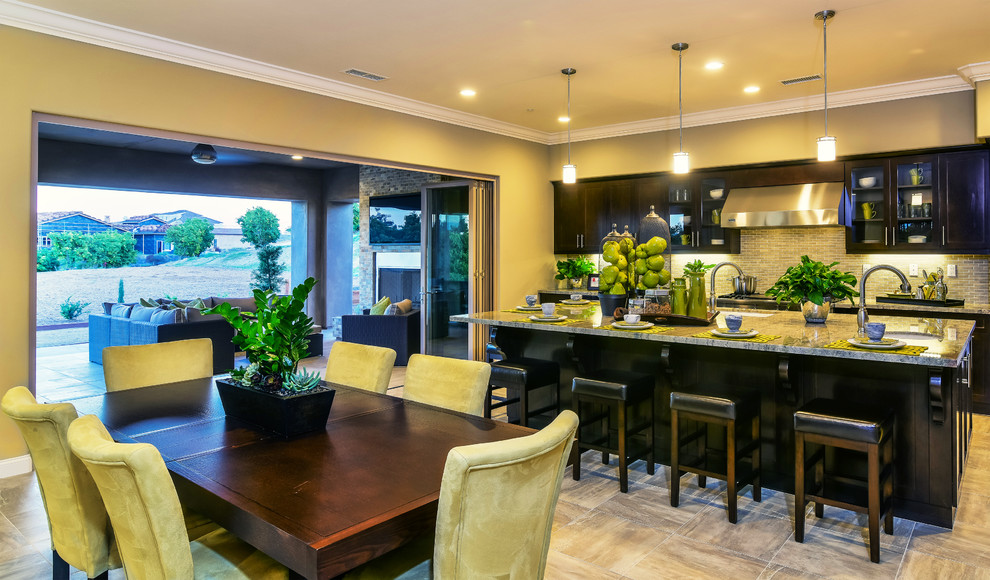 Photo of a medium sized contemporary open plan dining room in San Diego with beige walls, light hardwood flooring, no fireplace and beige floors.
