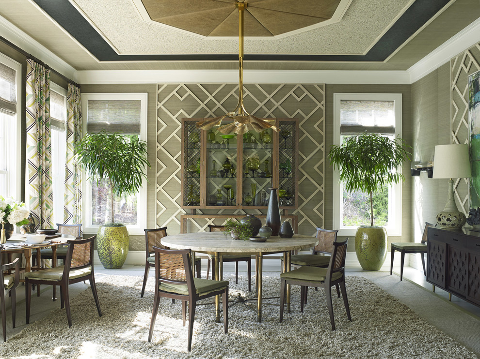 This is an example of an eclectic dining room in Portland with feature lighting.