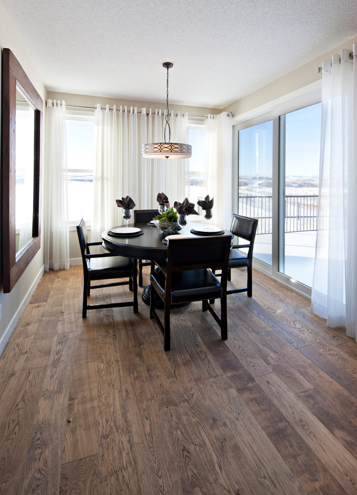 Inspiration for a timeless dark wood floor dining room remodel in Calgary with beige walls