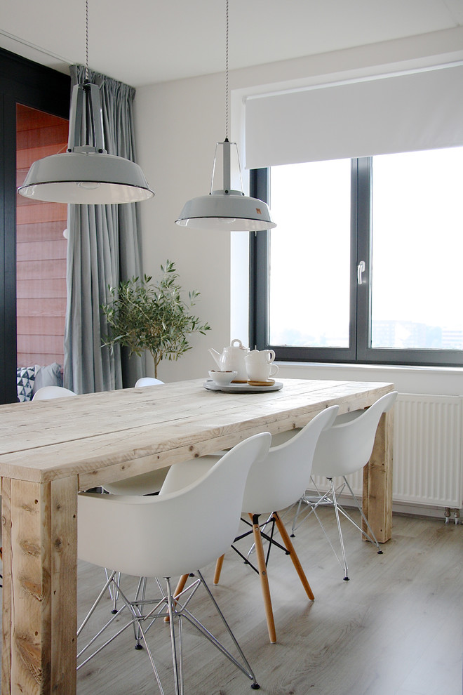 Photo of a scandinavian dining room in Amsterdam with white walls.