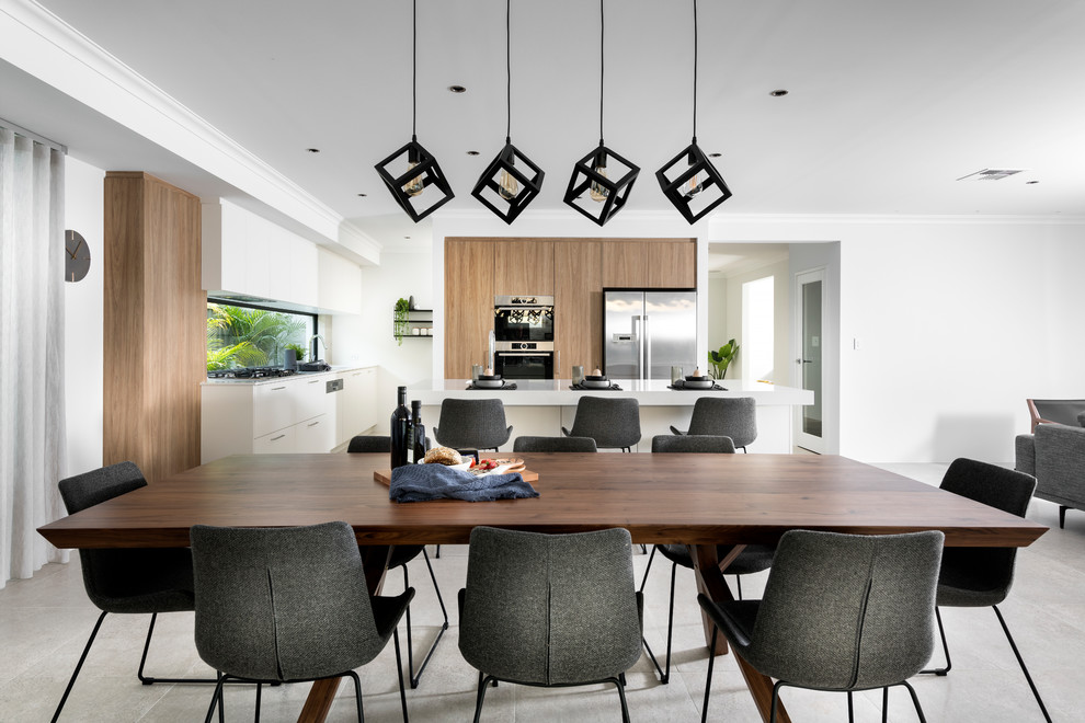 Contemporary open plan dining room in Perth with white walls and grey floors.