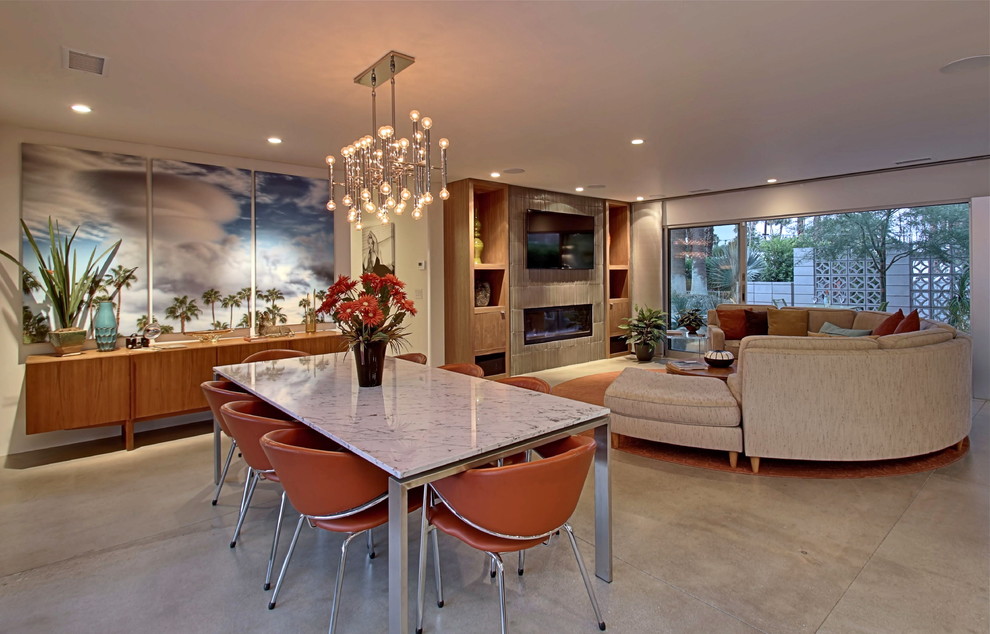 Example of a mid-sized 1950s concrete floor great room design in Los Angeles with white walls
