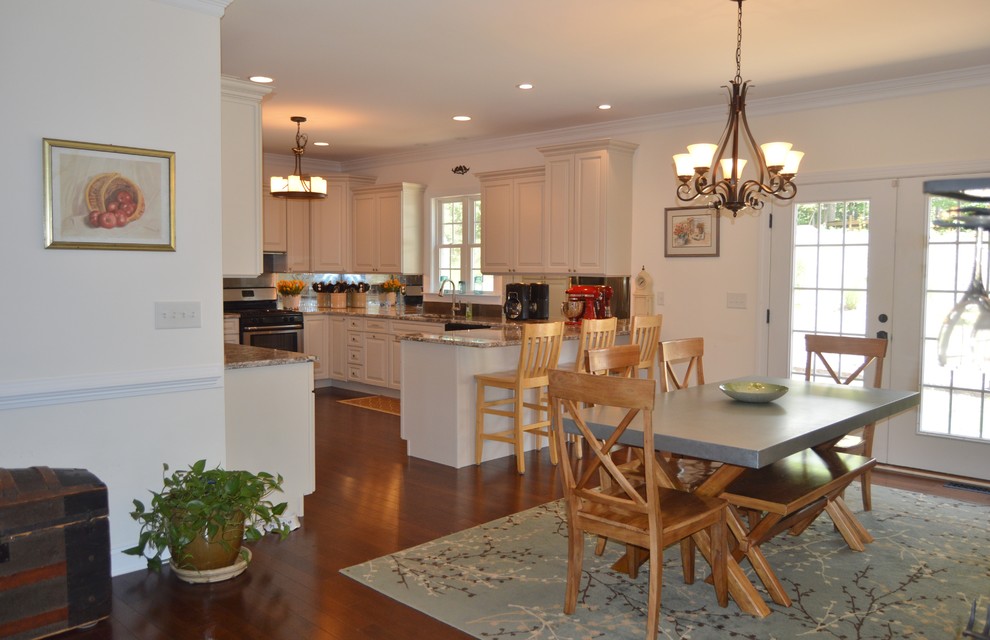 Example of a mid-sized arts and crafts medium tone wood floor kitchen/dining room combo design in DC Metro with white walls and no fireplace