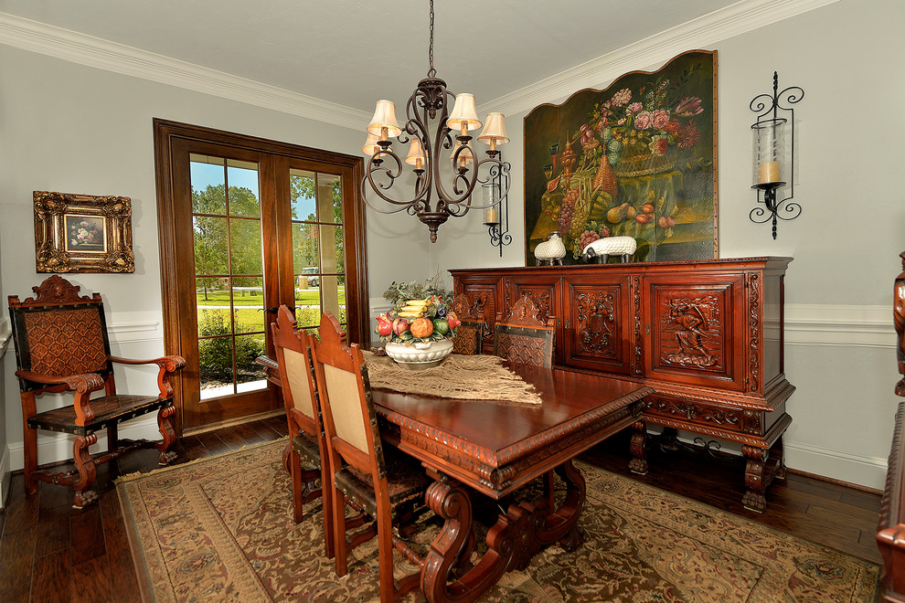 Photo of a medium sized traditional enclosed dining room in Phoenix with blue walls and dark hardwood flooring.