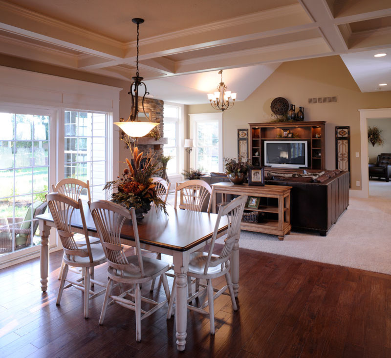 Inspiration for a rustic medium tone wood floor and coffered ceiling kitchen/dining room combo remodel with beige walls