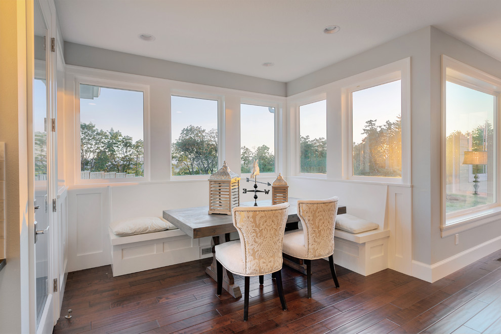 Example of a classic dark wood floor dining room design in Vancouver with gray walls