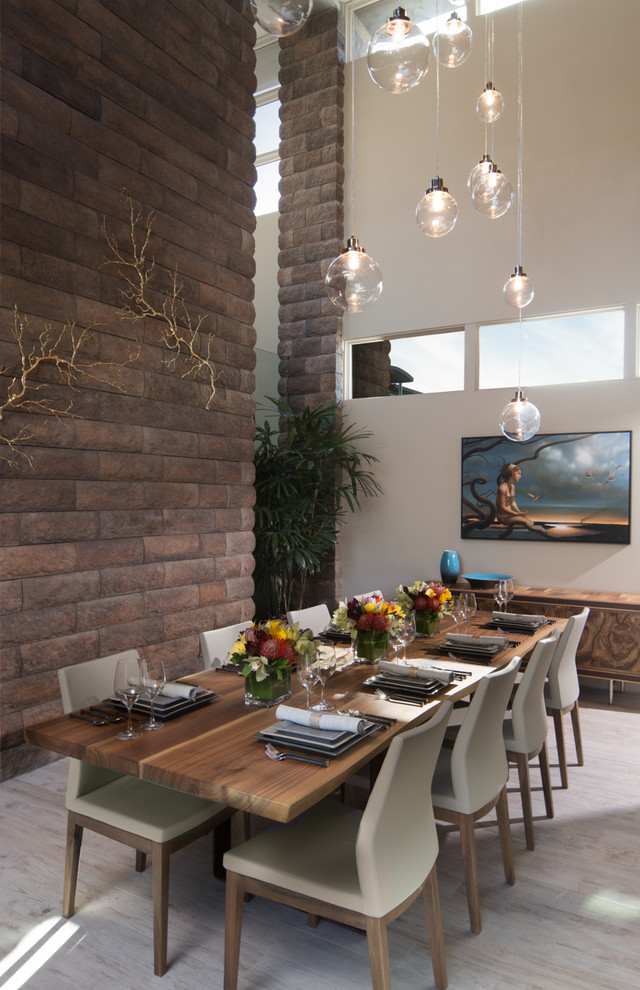 Example of a large trendy porcelain tile enclosed dining room design in Sacramento with beige walls and no fireplace