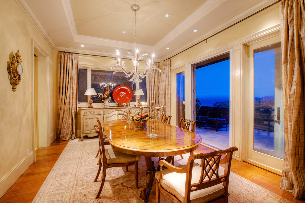 Medium sized mediterranean enclosed dining room in San Francisco with beige walls and medium hardwood flooring.
