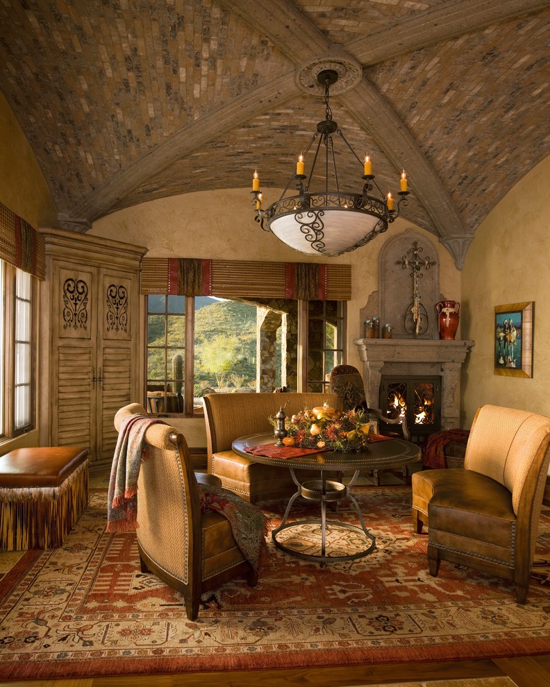Inspiration for a rustic carpeted kitchen/dining room combo remodel in Phoenix with a stone fireplace and a wood stove