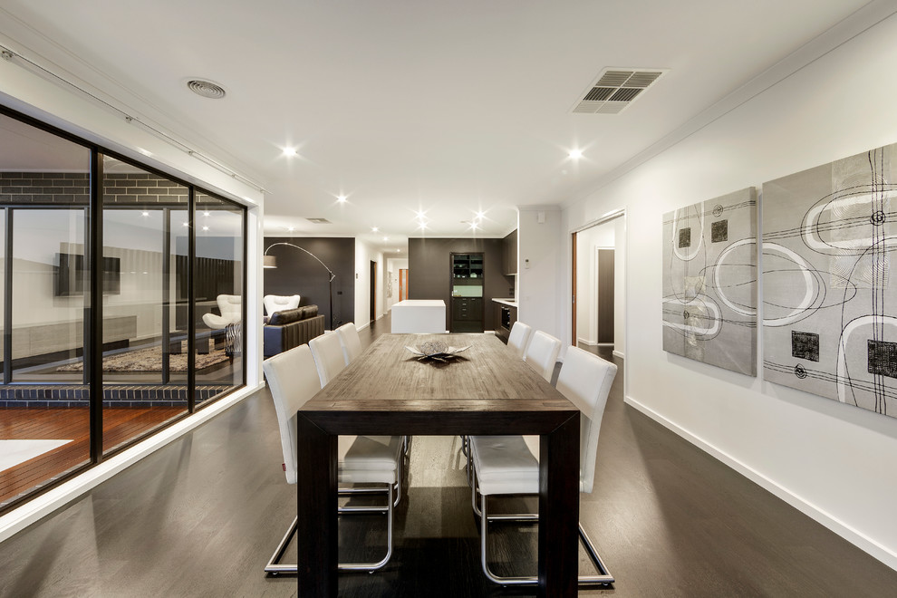 Photo of a medium sized modern kitchen/dining room in Sydney with white walls and dark hardwood flooring.