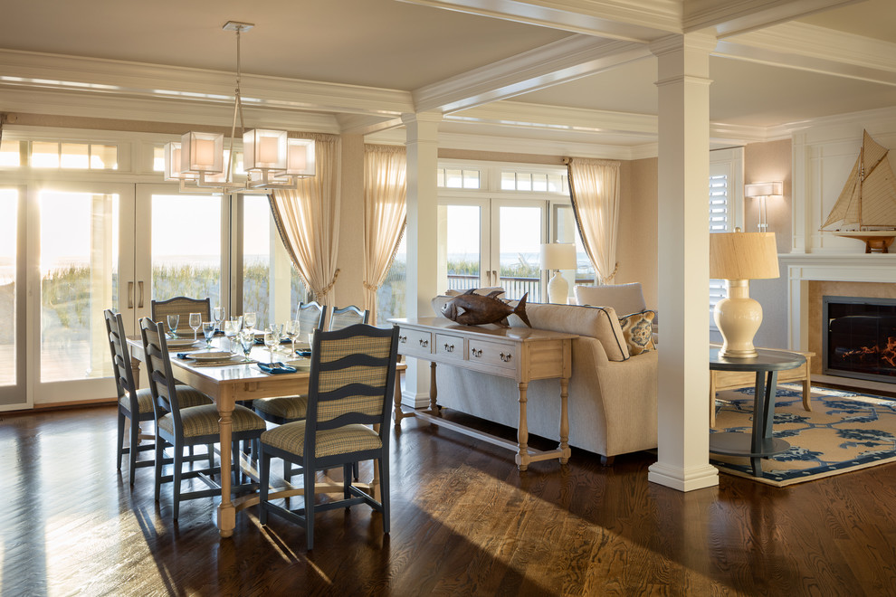 Coastal open plan dining room in New York with beige walls, dark hardwood flooring and brown floors.