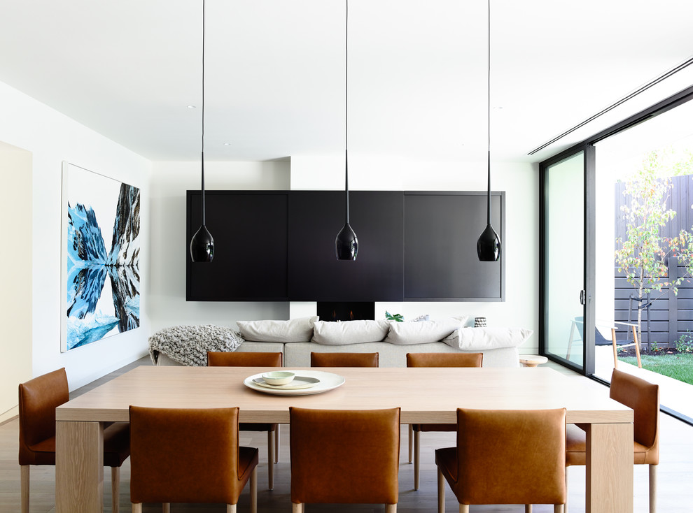 Photo of a modern open plan dining room in Melbourne.