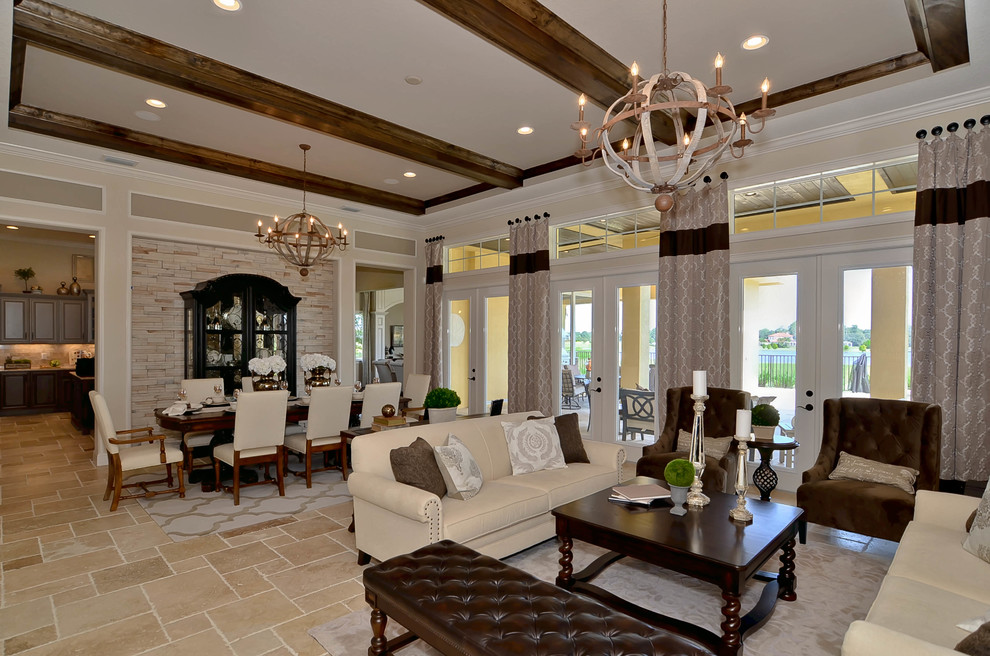 Design ideas for a medium sized mediterranean open plan dining room in Tampa with beige walls and travertine flooring.